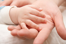 baby and adult hands