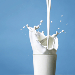 Milk Pouring into Glass