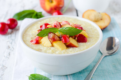 Milk porridge with peaches and cherries